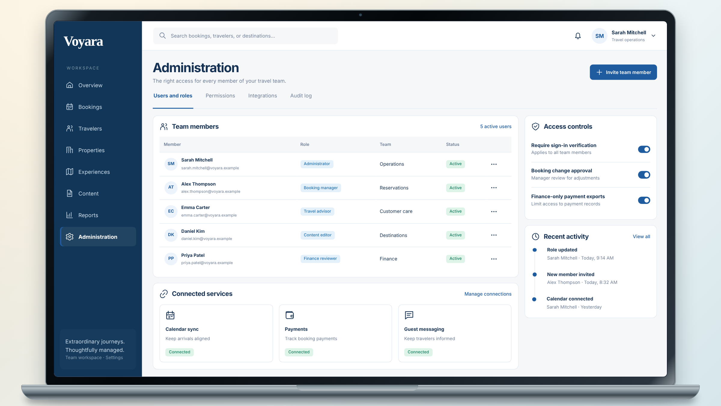 Voyara client project: team administration shown on a laptop.